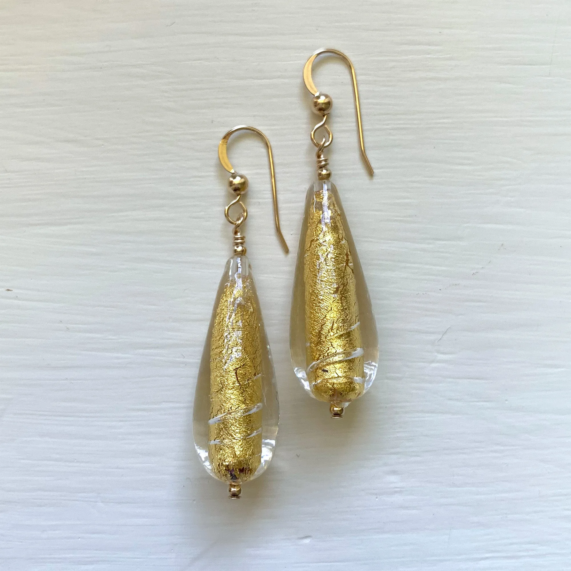 Earrings with light (pale) gold Murano glass long pear drops on silver or gold hooks